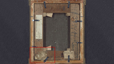 Die Rückseite des Holzrahmens; ein Klebezettel unten links ist mit einem roten Kasten eingerahmt