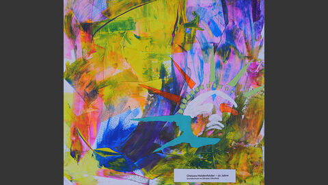 Die Freiheitsstatue vor einem bunten Hintergrund.