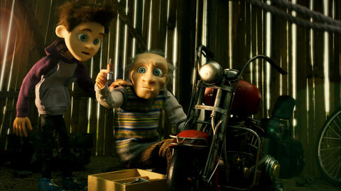 Szene aus "Der perfekte Tag" Szene aus "Der perfekte Tag": Zwei animierte Figuren, ein Junge und ein alter Mann, sitzen in einem Schuppen