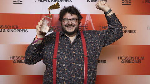 Preisträger vor Fotowand