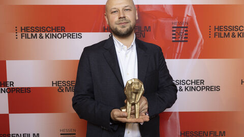 Preisträger vor Fotowand