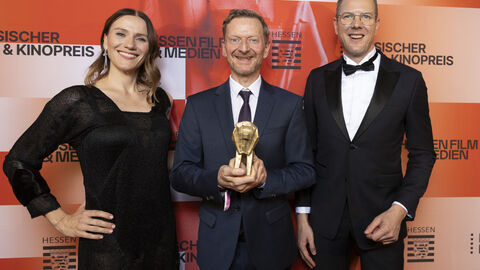 Preisträger vor Fotowand